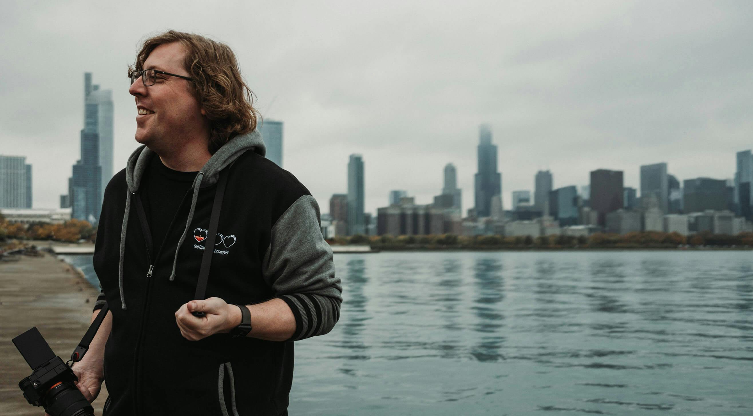 Photo of Josh in front of the Chicago city skyline